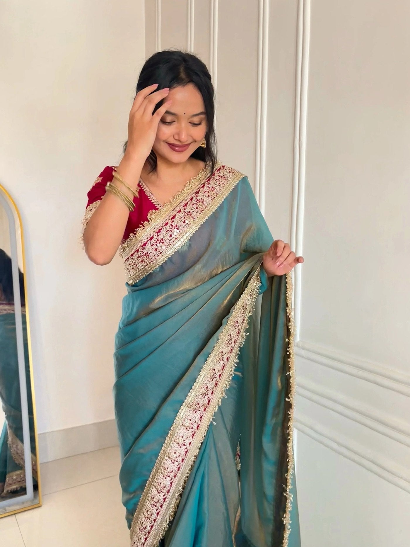 Fancy Blue Saree With Golden Embellished Border.