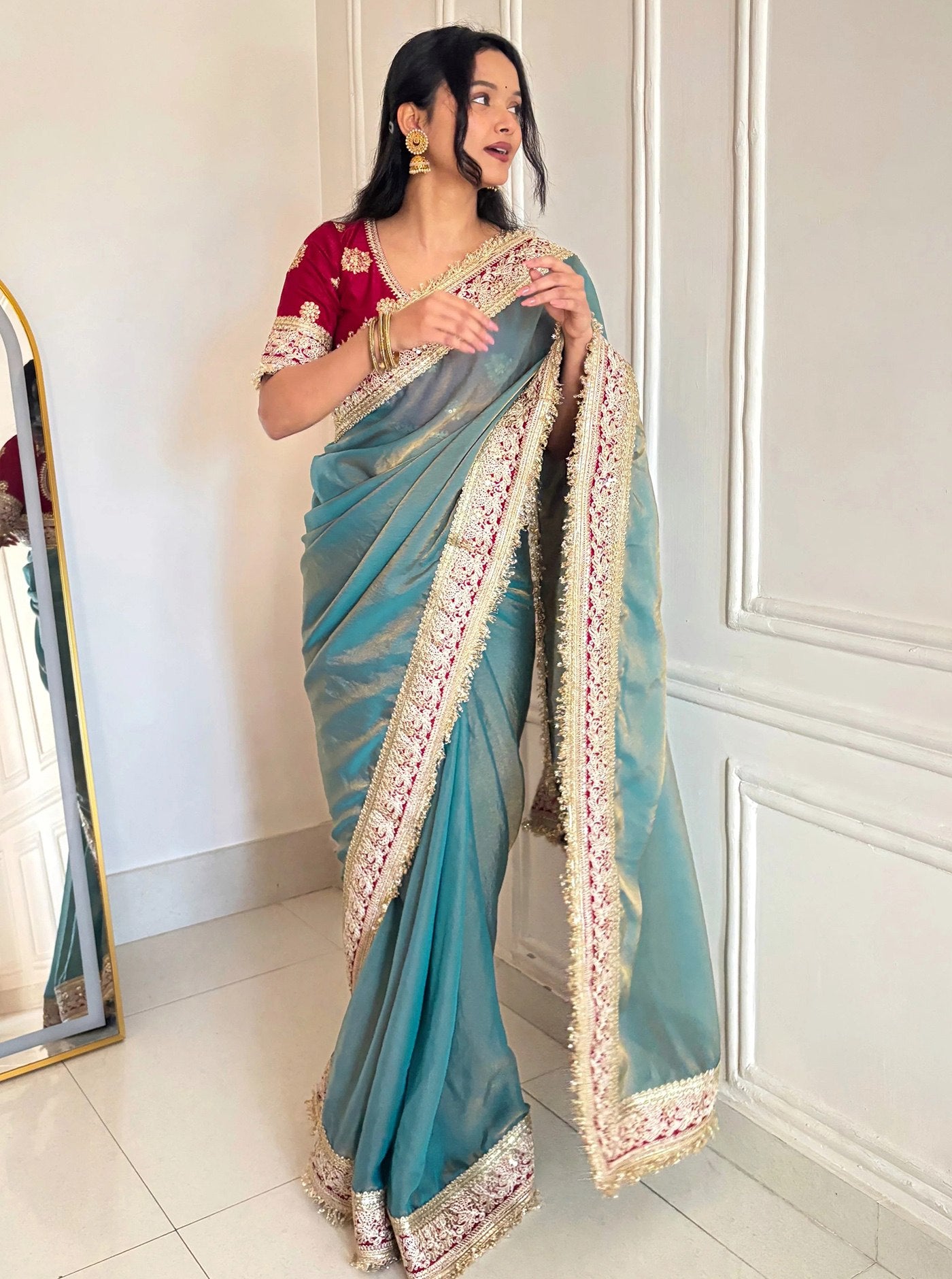 Fancy Blue Saree With Golden Embellished Border.