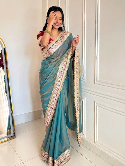 Fancy Blue Saree With Golden Embellished Border.