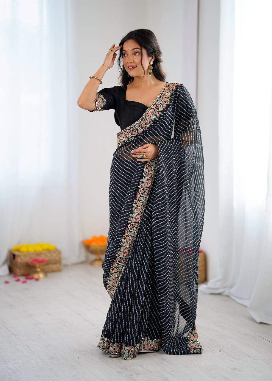 Elegant Purple Leheriya Saree with Rich Embroidered Border.
