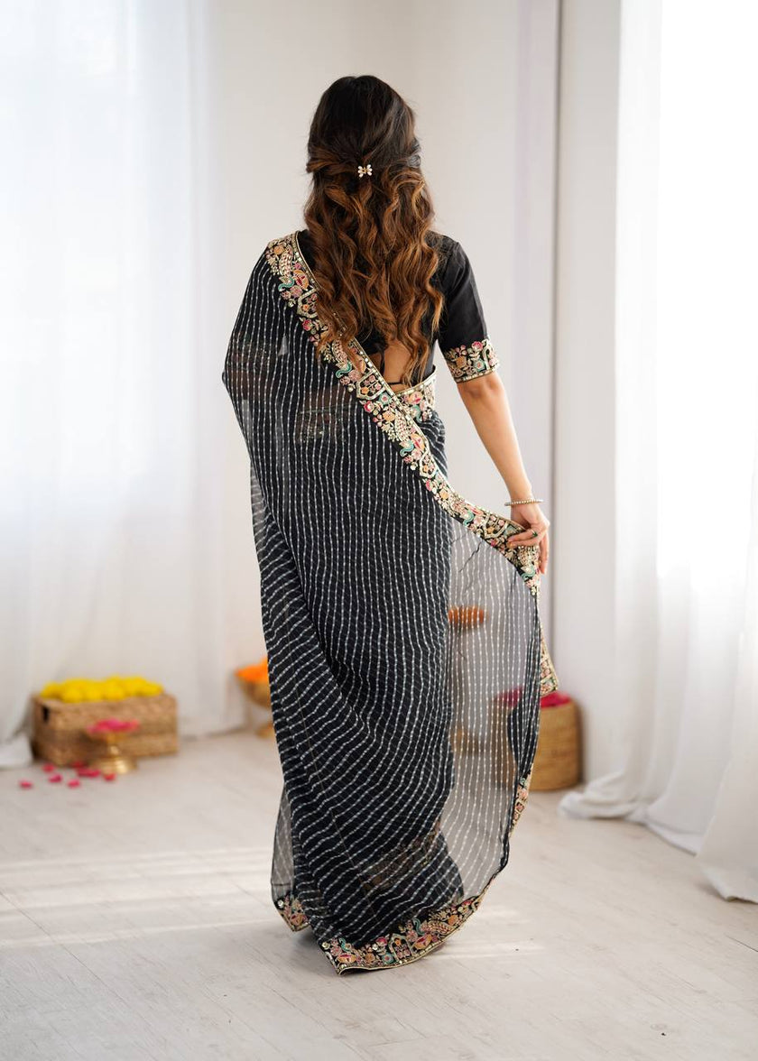 Elegant Purple Leheriya Saree with Rich Embroidered Border.