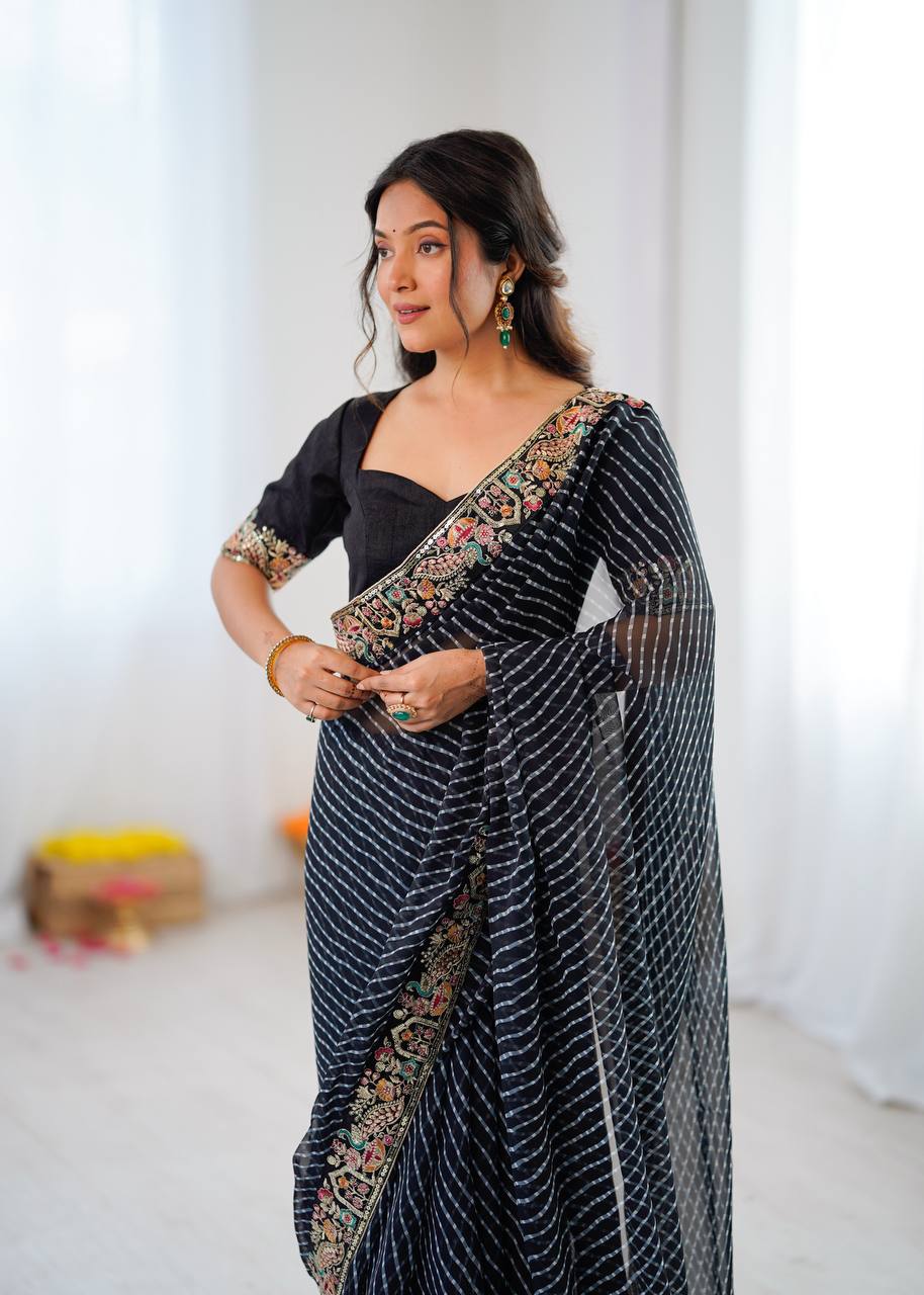 Elegant Purple Leheriya Saree with Rich Embroidered Border.