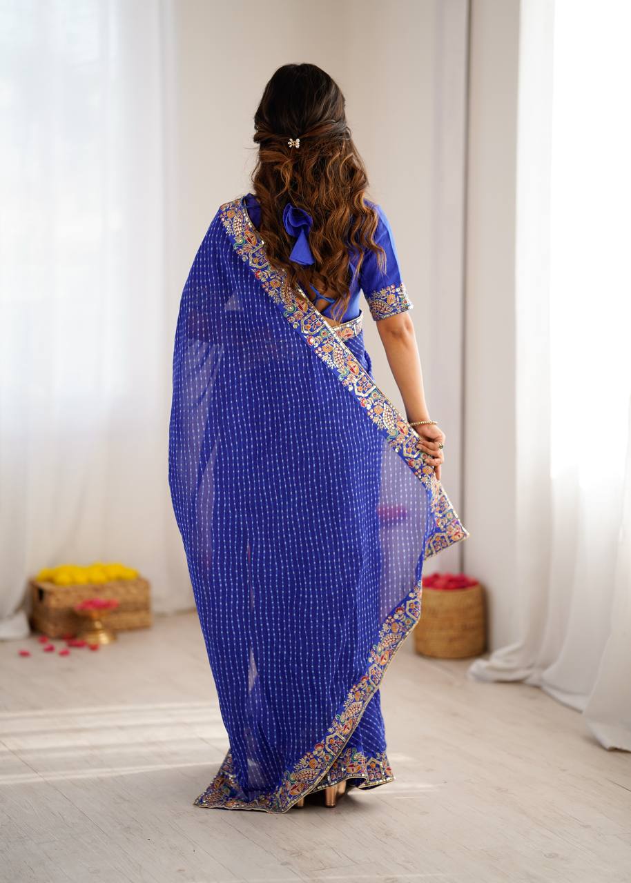 Elegant Purple Leheriya Saree with Rich Embroidered Border.