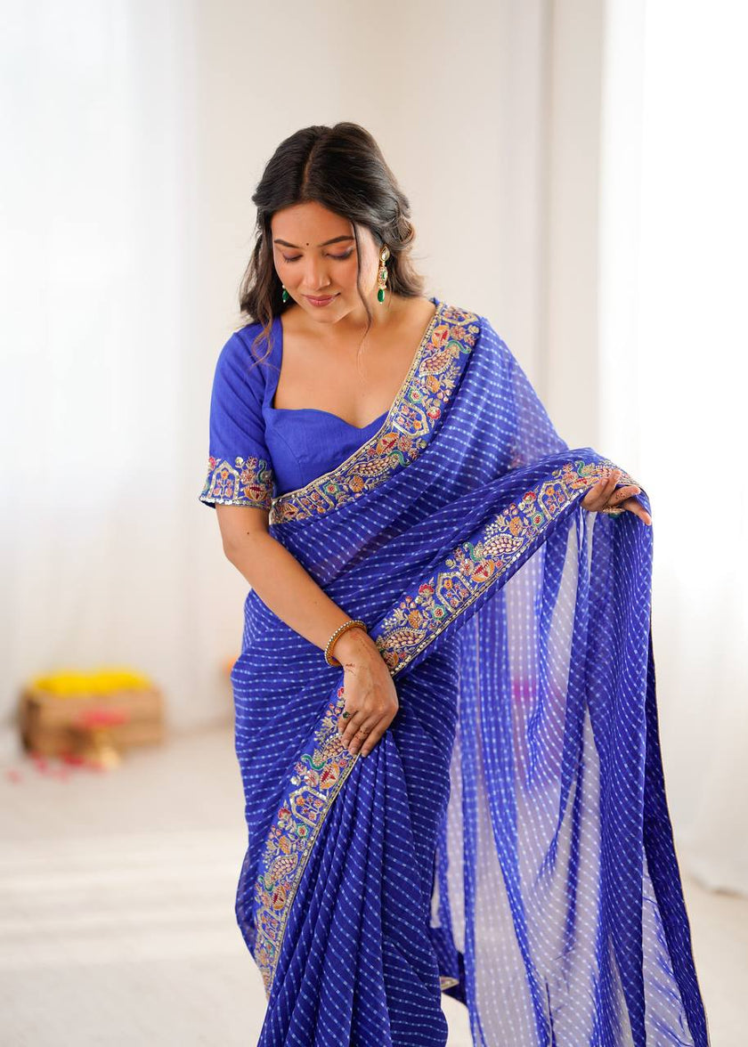 Elegant Purple Leheriya Saree with Rich Embroidered Border.