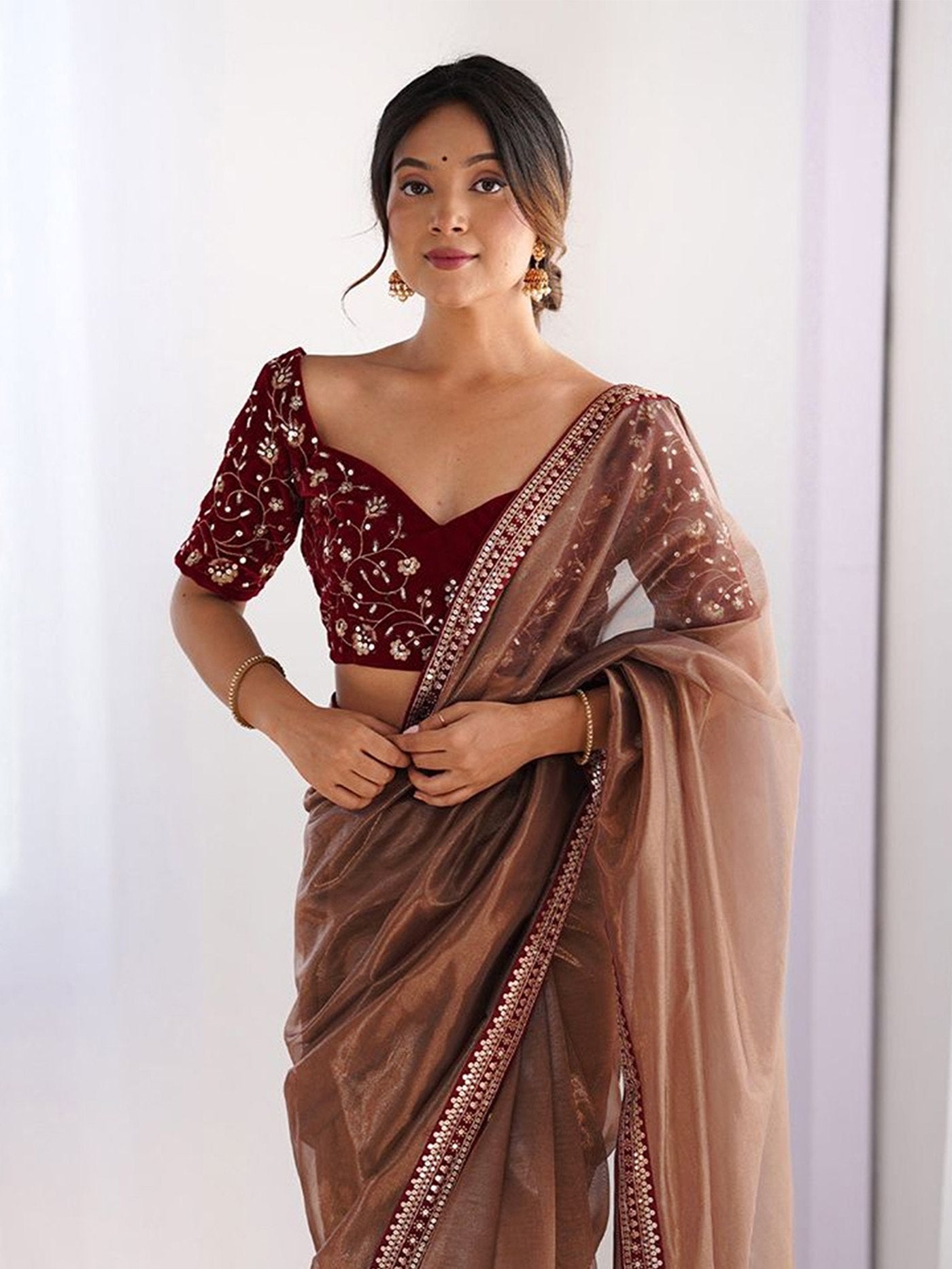 Traditional Brown Saree with Sequence Border Work.