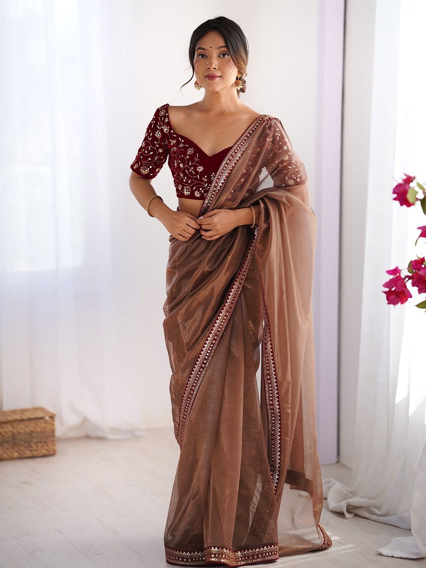 Traditional Brown Saree with Sequence Border Work.