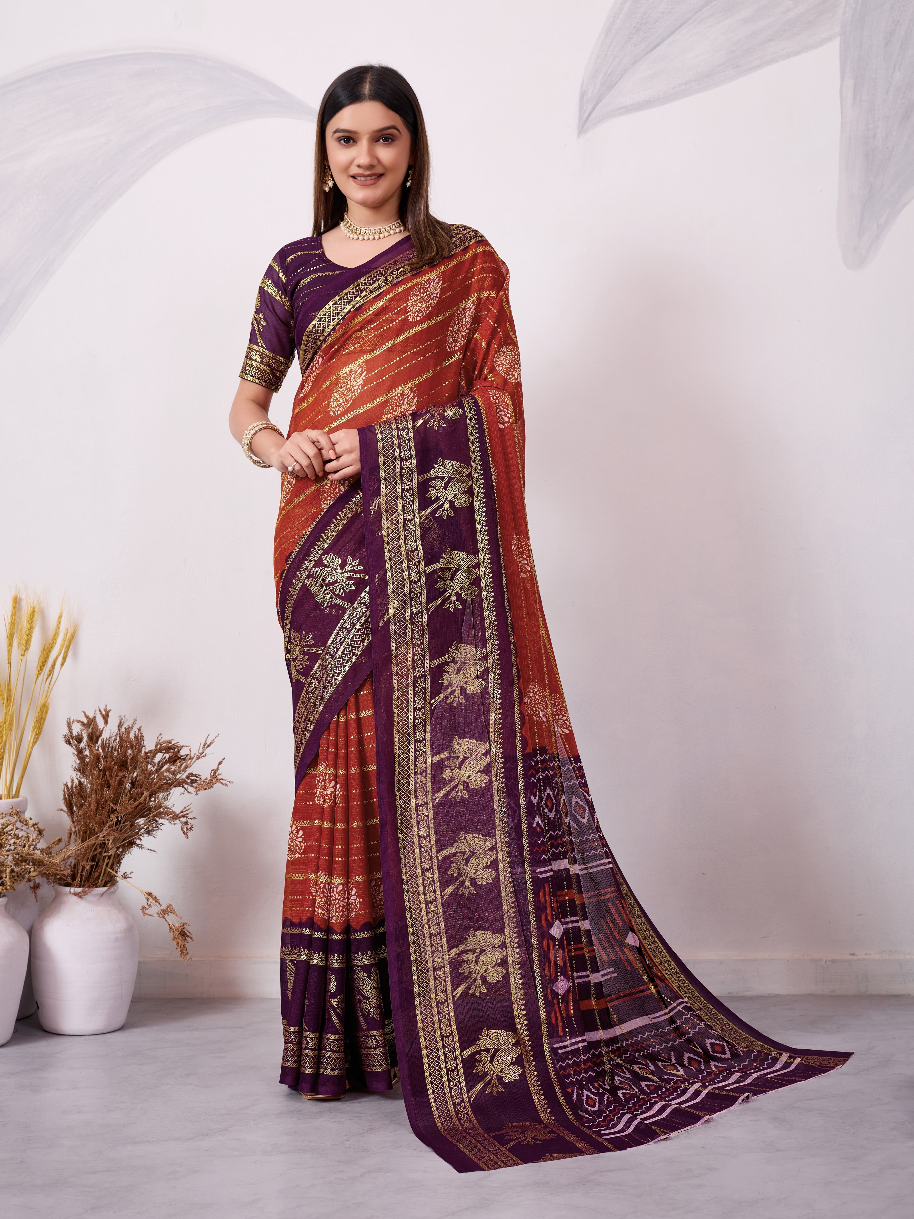 Orange and magenta traditional printed saree with gold zari border