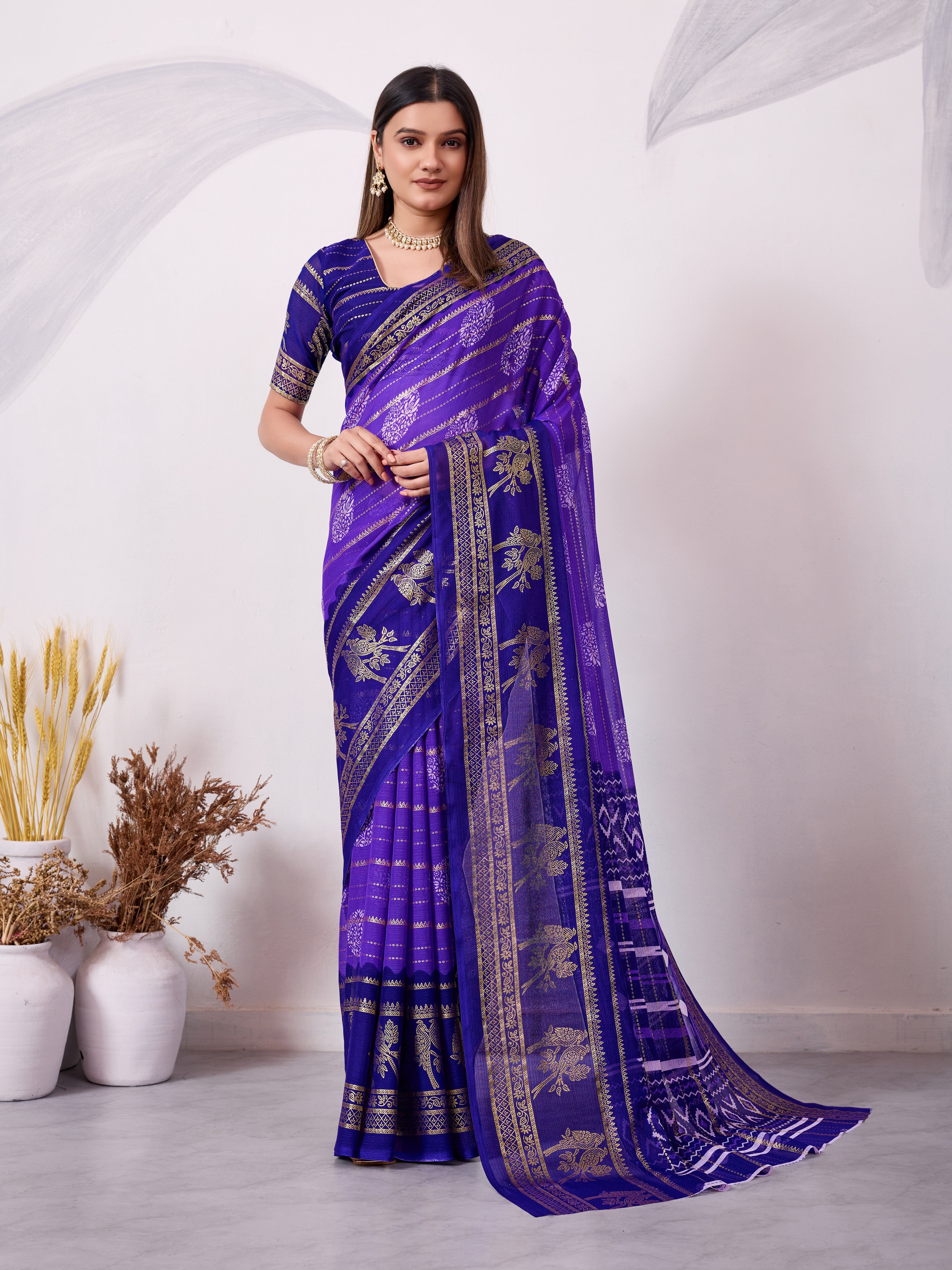 Purple and traditional printed saree with gold zari border