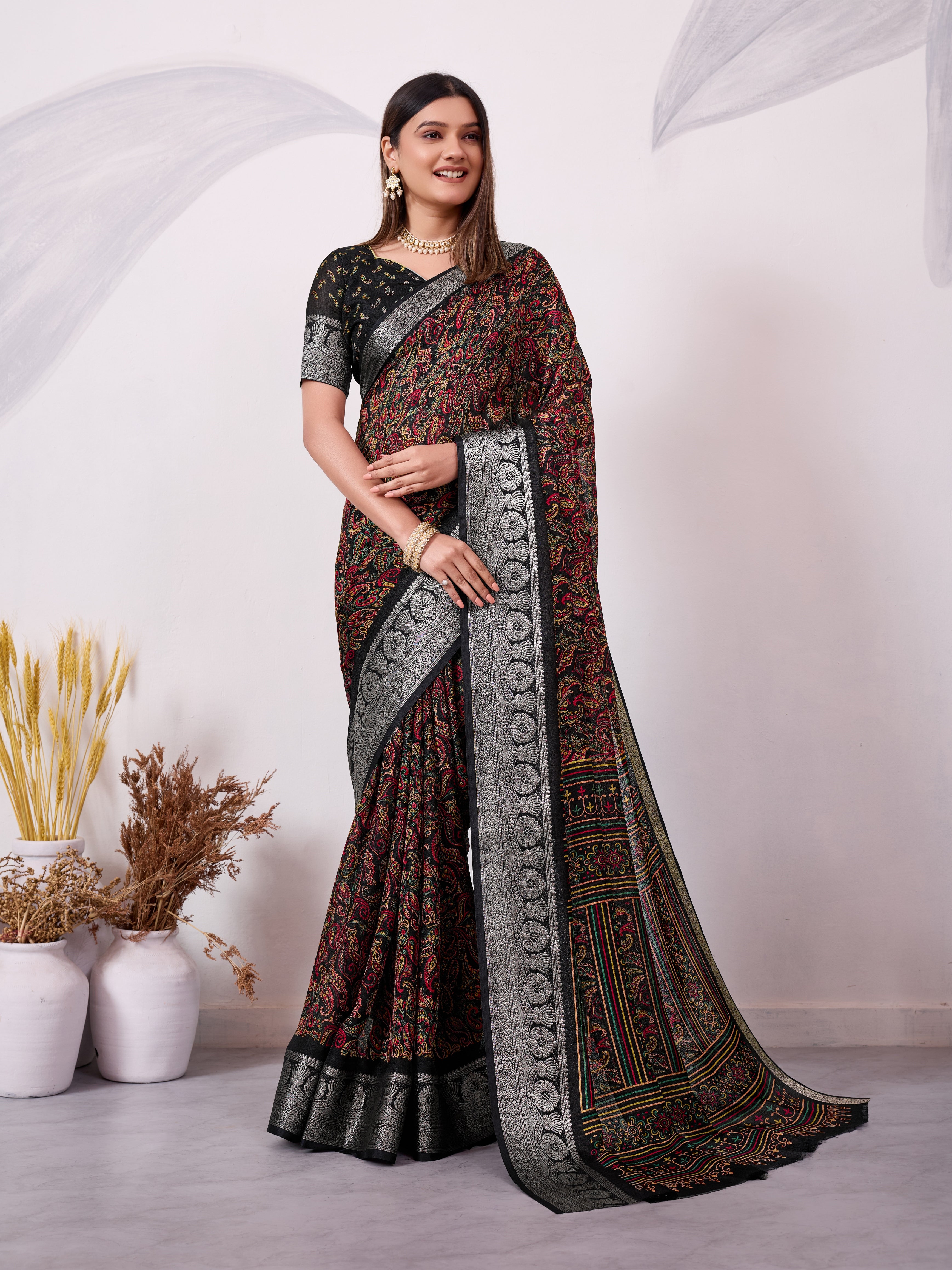 Black ethnic print saree with silver zari border and traditional motifs