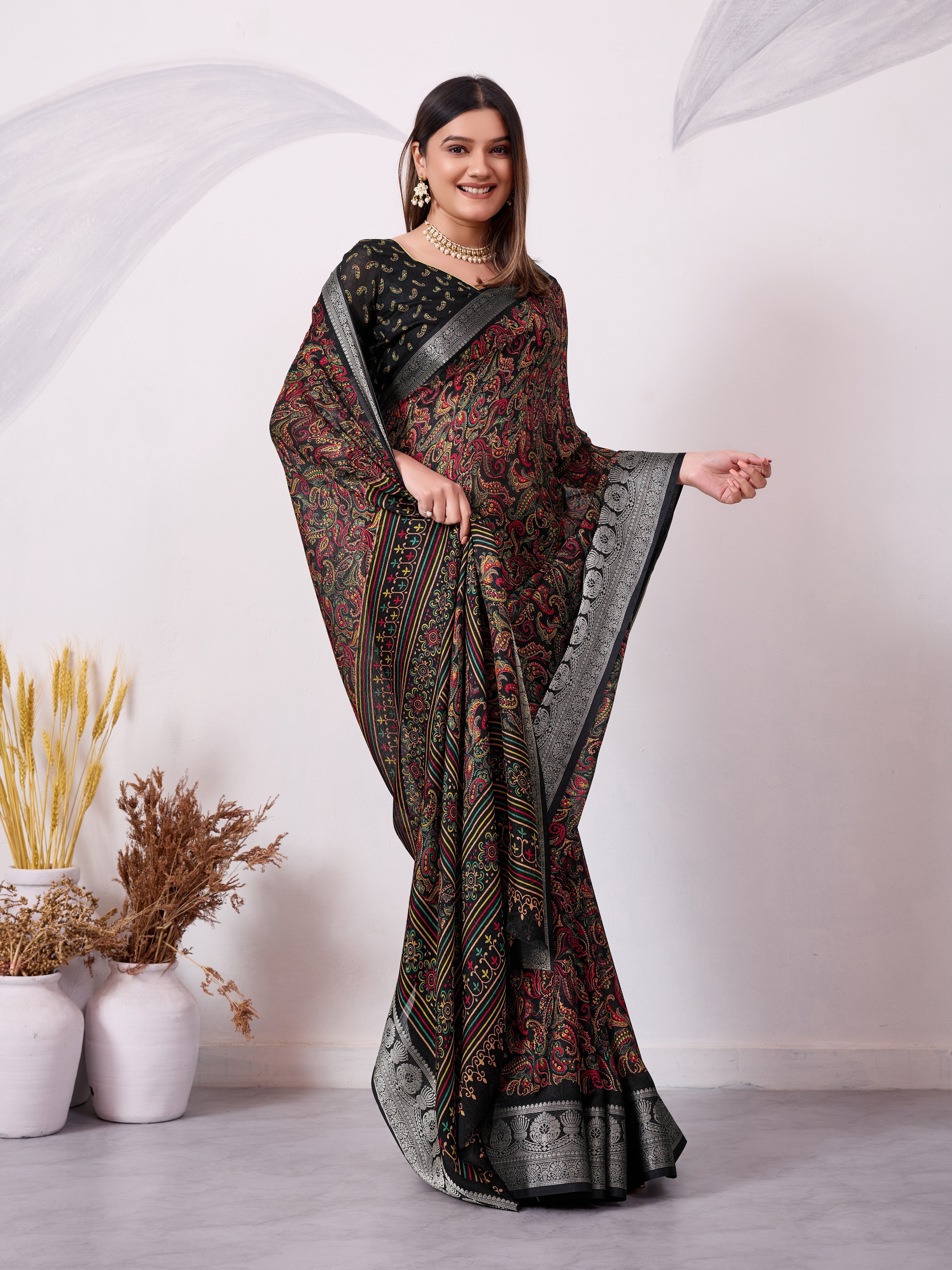 Elegant Printed Saree with Traditional Woven Border.
