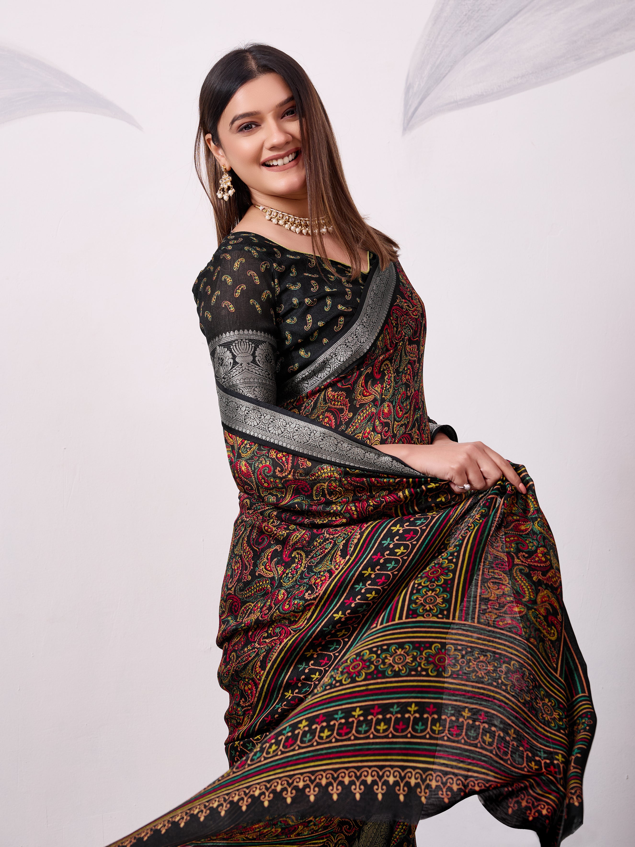 Elegant Printed Saree with Traditional Woven Border.