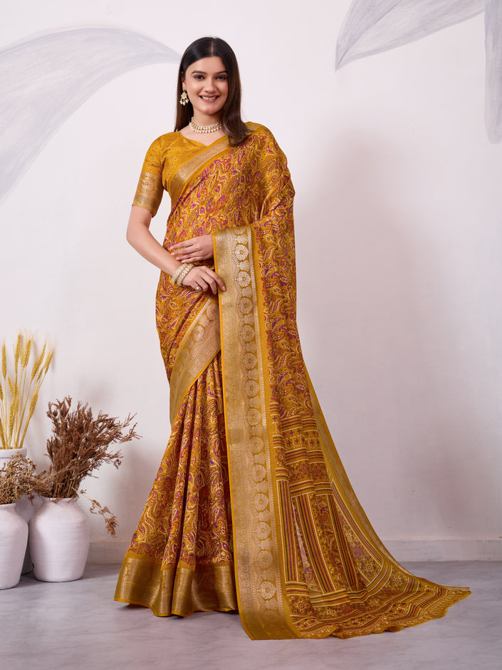 Yellow ethnic print saree with silver zari border and traditional motifs