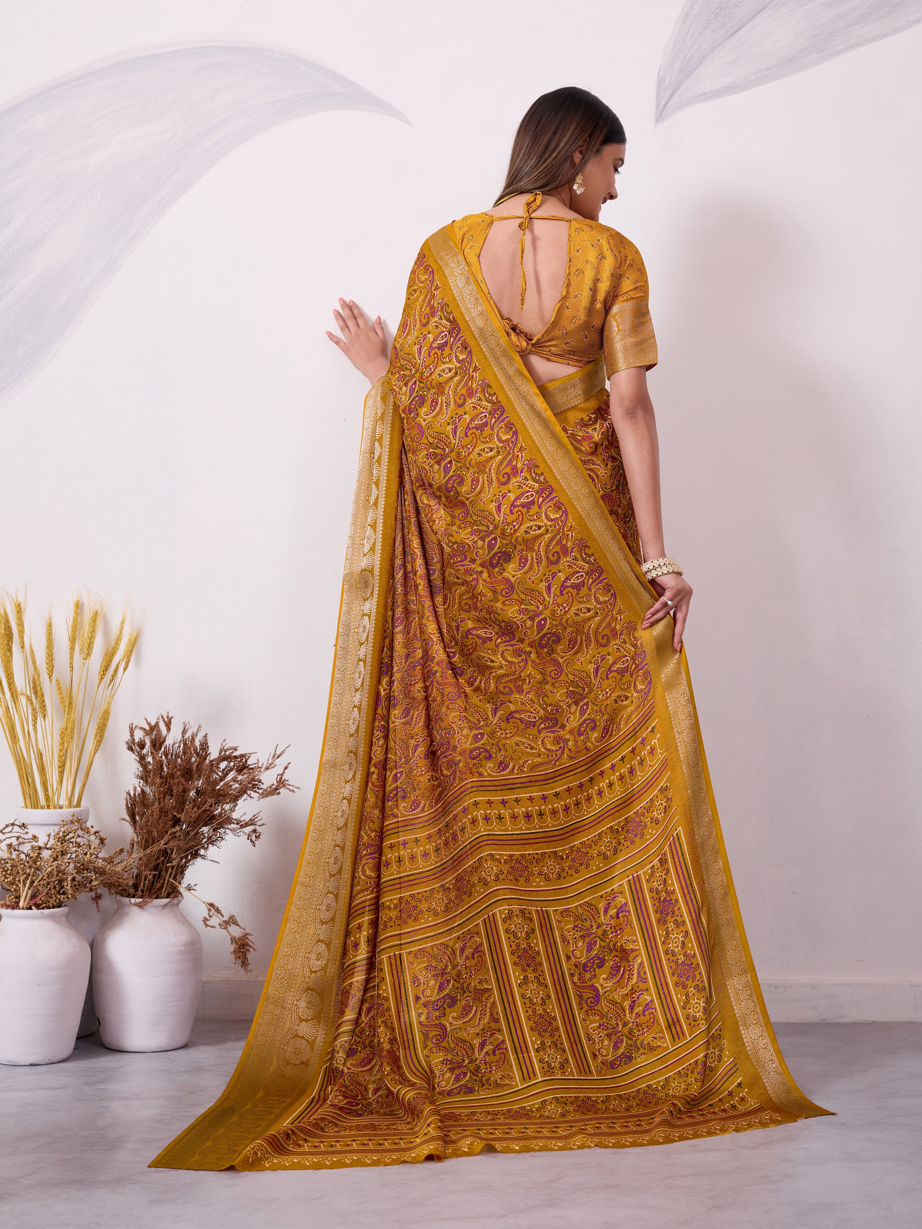 Elegant Printed Saree with Traditional Woven Border.