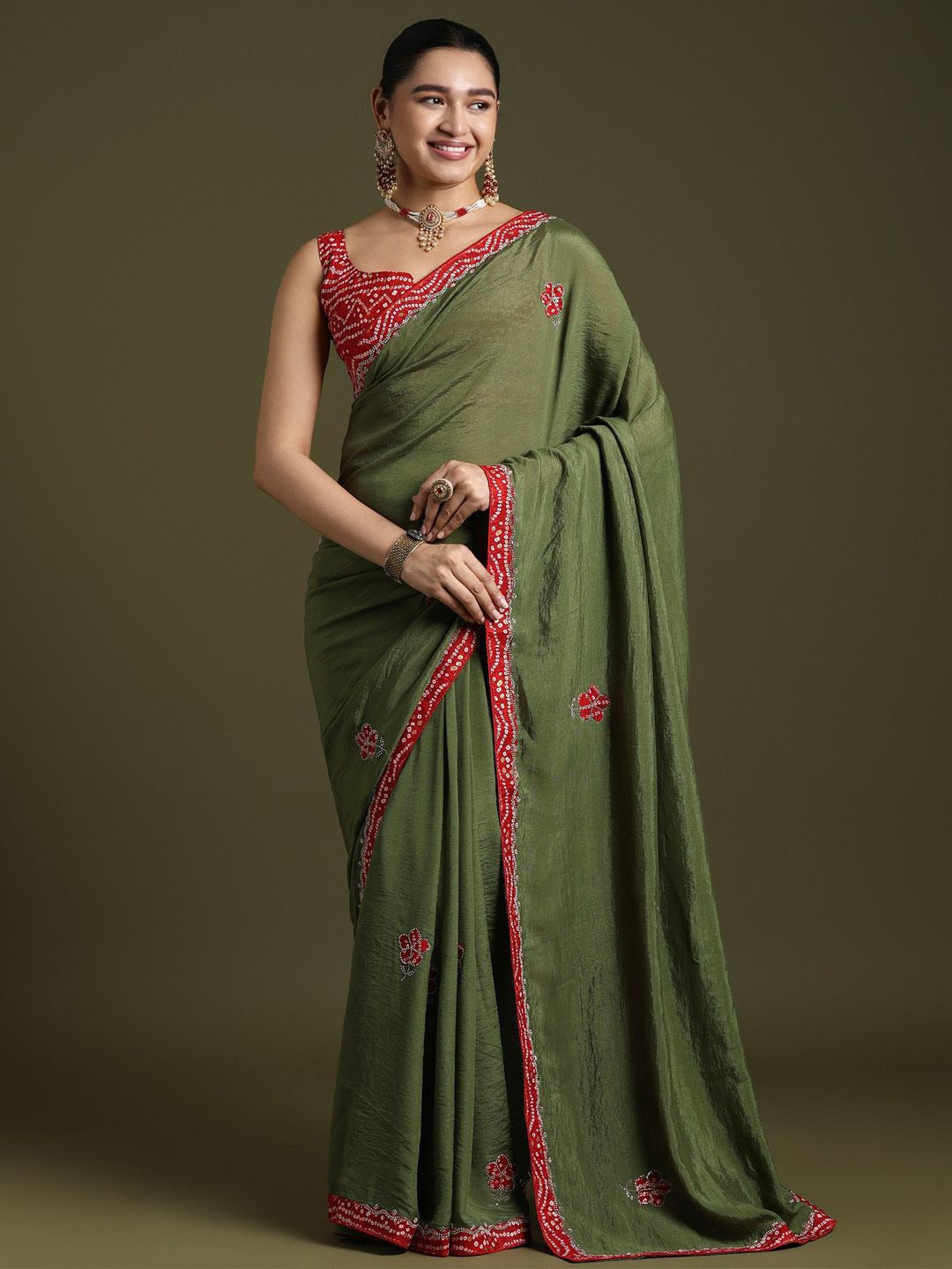 Elegant Green silk saree with red embroidered border and ethnic motifs