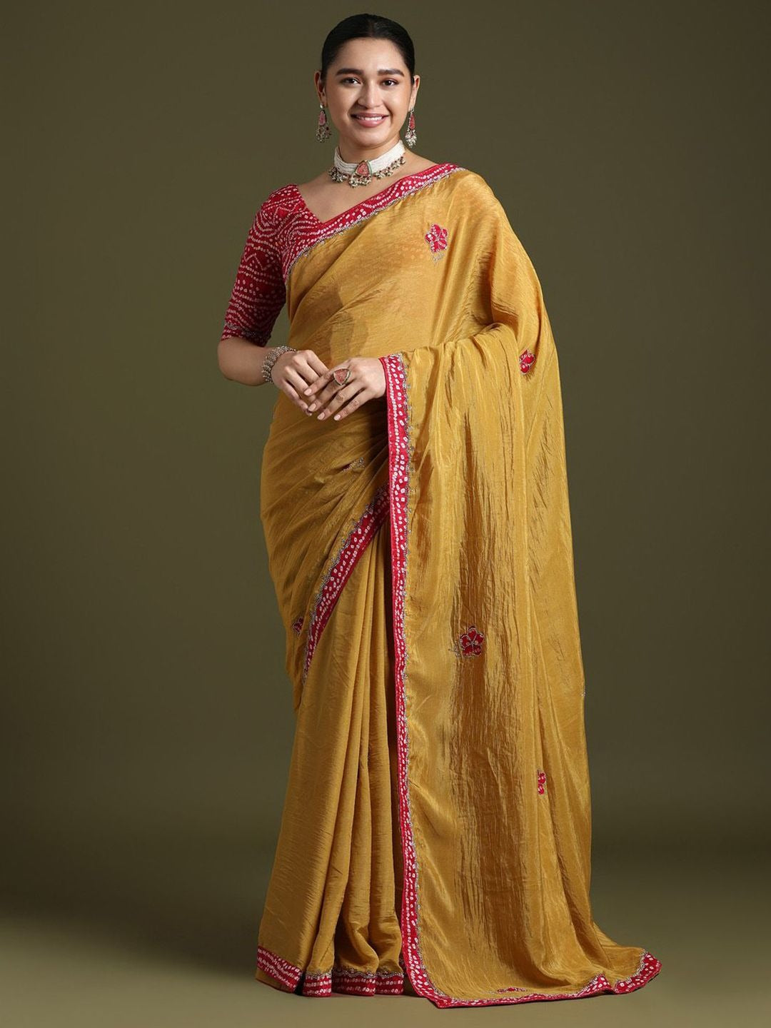 Elegant Yellow silk saree with red embroidered border and ethnic motifs