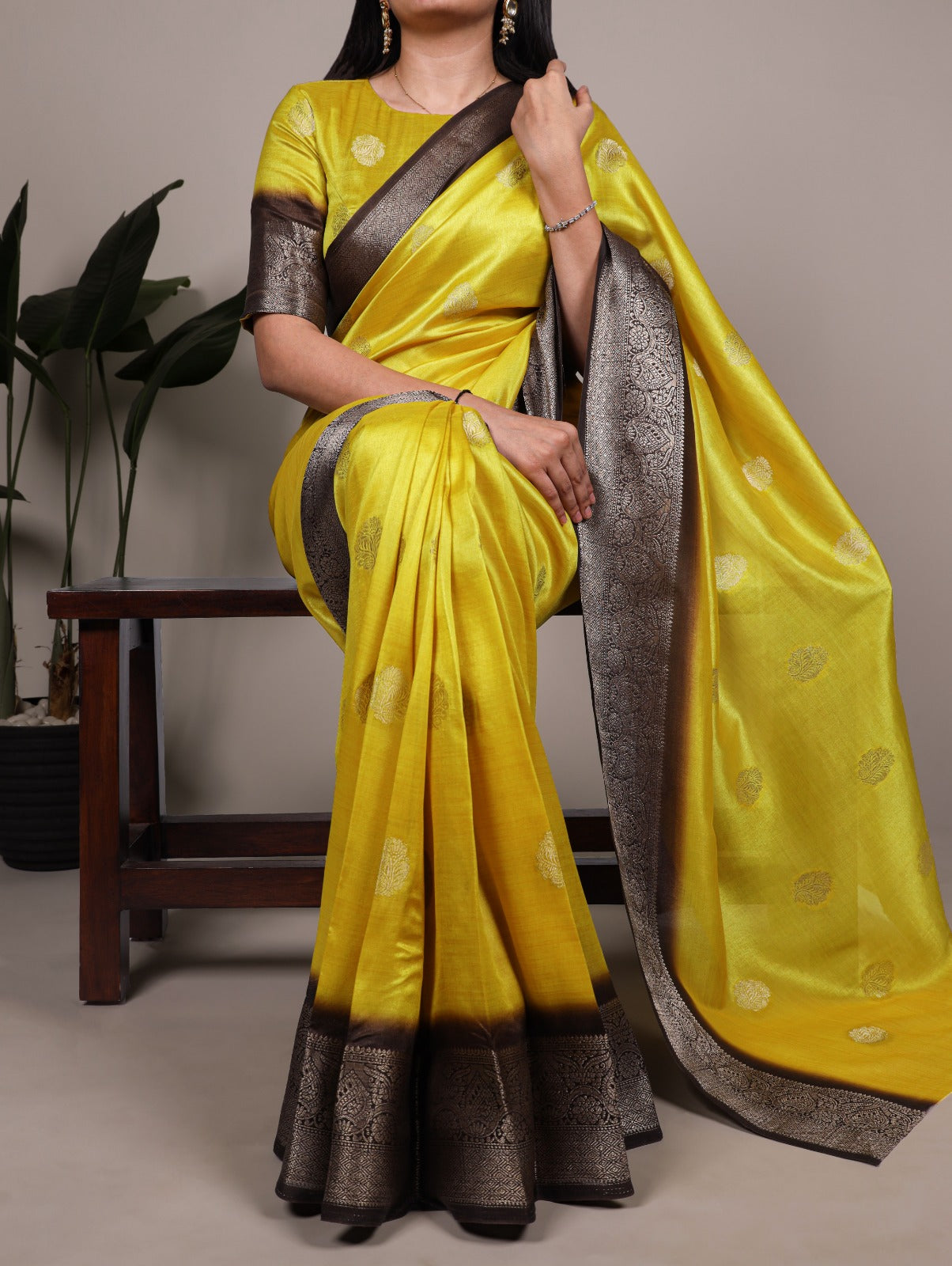 Elegant Banarasi Silk Blend Saree with Woven Zari Motifs.