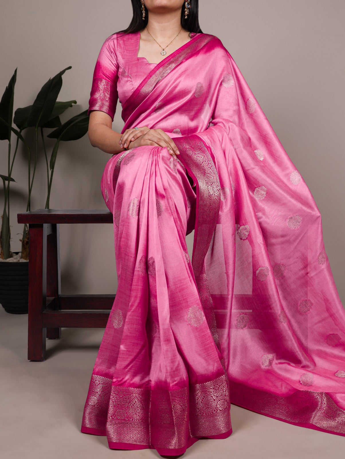 Elegant Banarasi Silk Blend Saree with Woven Zari Motifs.