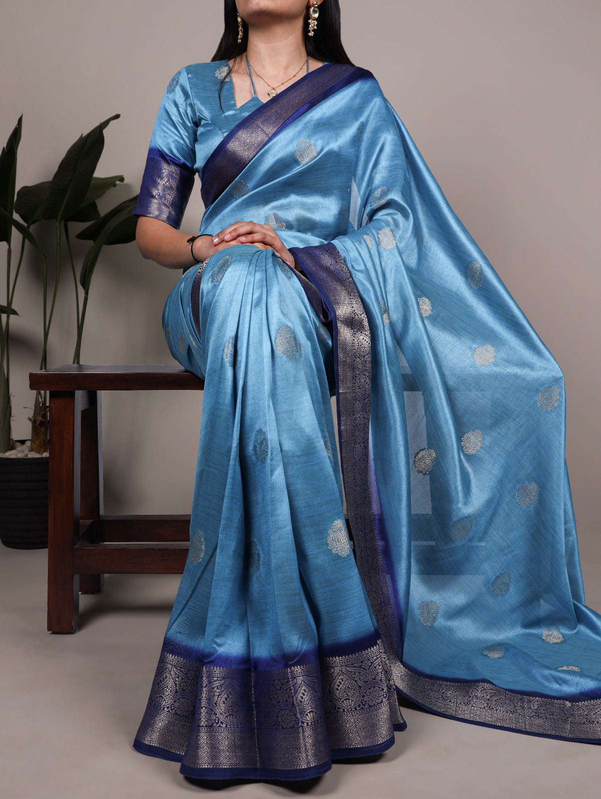 Elegant Banarasi Silk Blend Saree with Woven Zari Motifs.