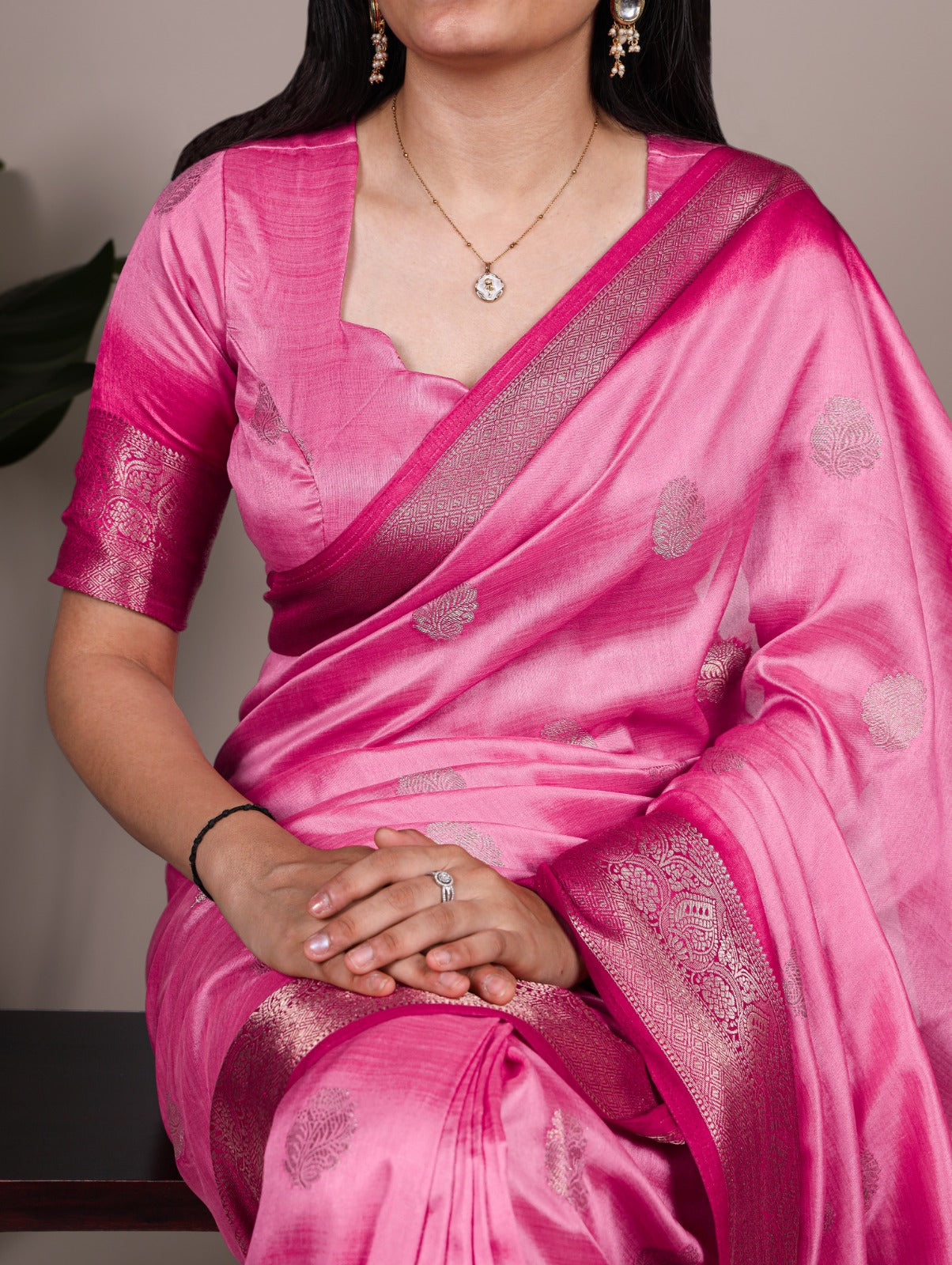 Elegant Banarasi Silk Blend Saree with Woven Zari Motifs.