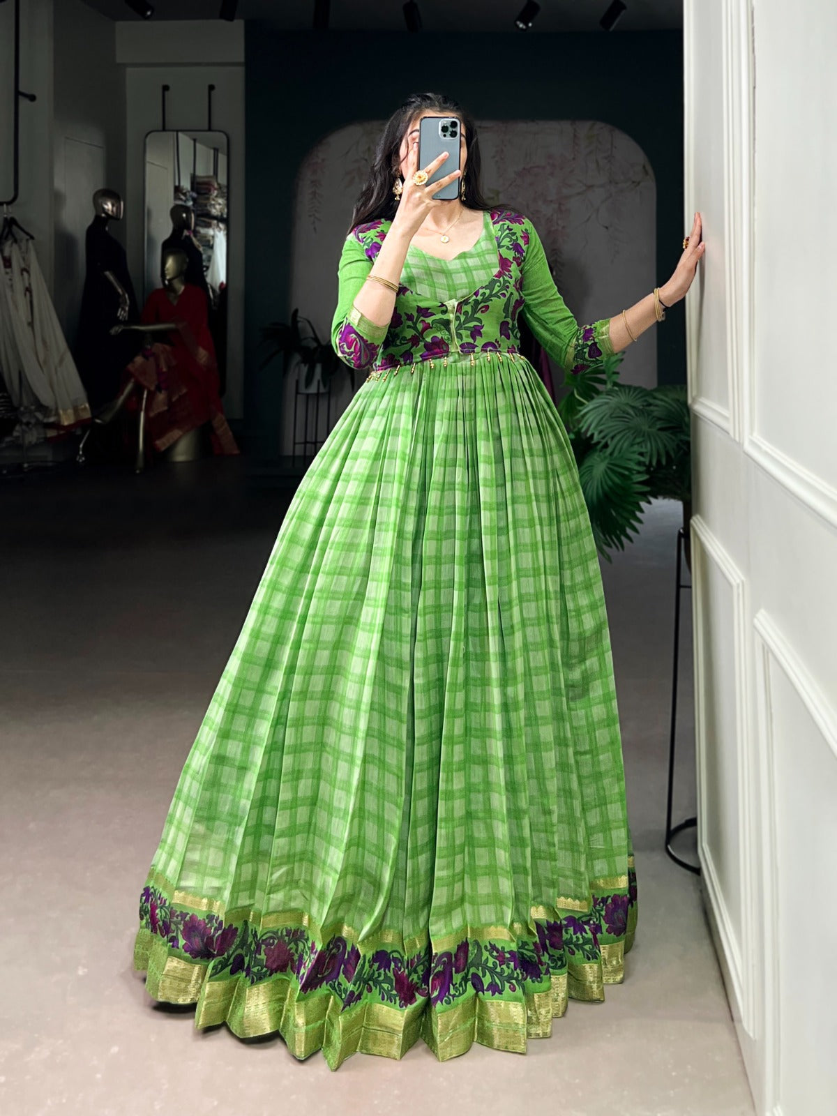 Women’s Green Anarkali suit with embroidered bodice, printed skirt and traditional ethnic detailing