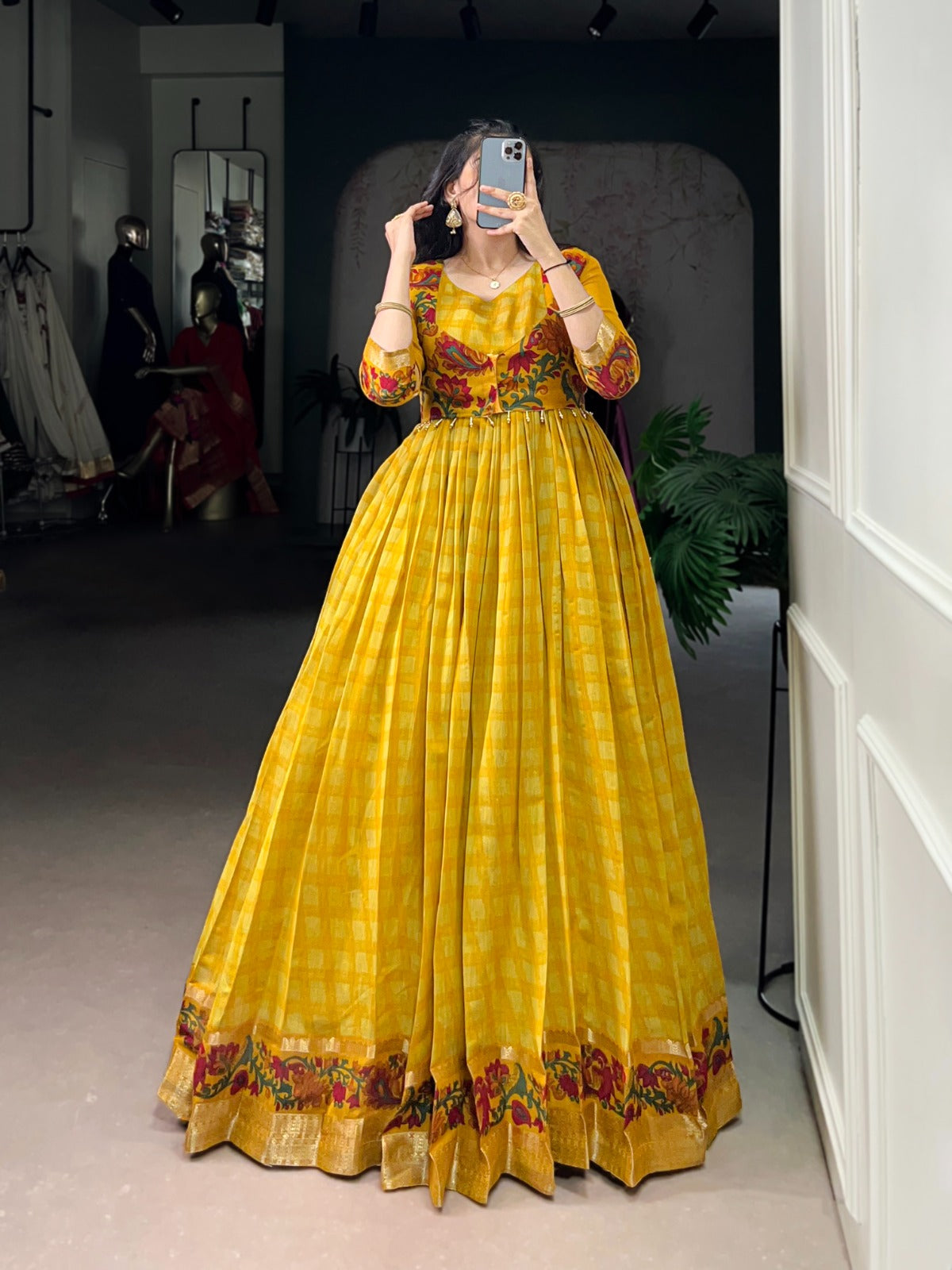 Women’s yellow Anarkali suit with embroidered bodice, printed skirt and traditional ethnic detailing