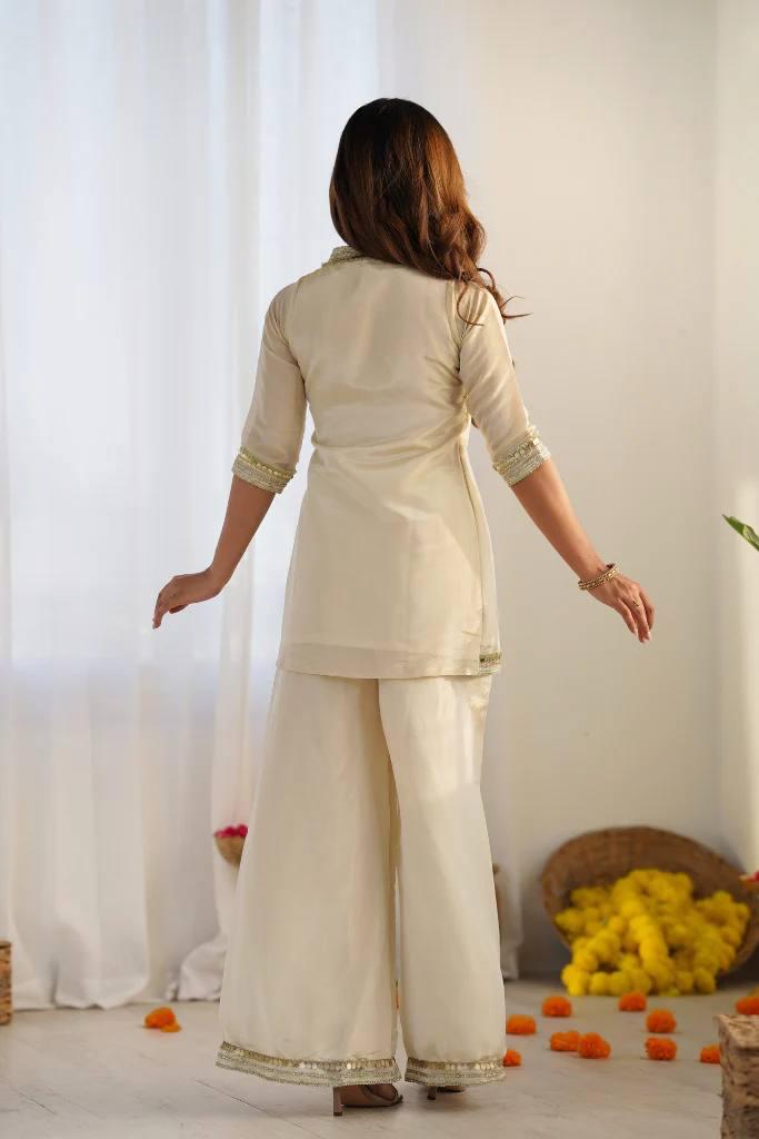 Graceful Ivory Embroidered Kurta Palazzo Set.
