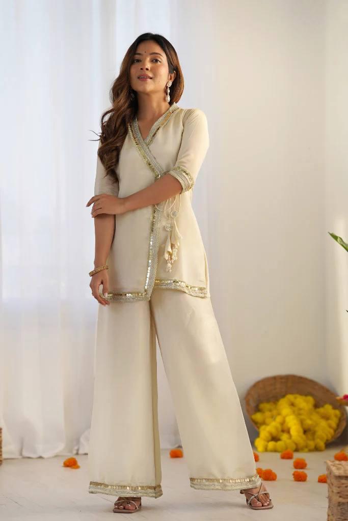 Graceful Ivory Embroidered Kurta Palazzo Set.