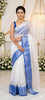 Graceful Festive Wear Organza Saree with Rich Silver Zari Weaving and Contrast Blouse.