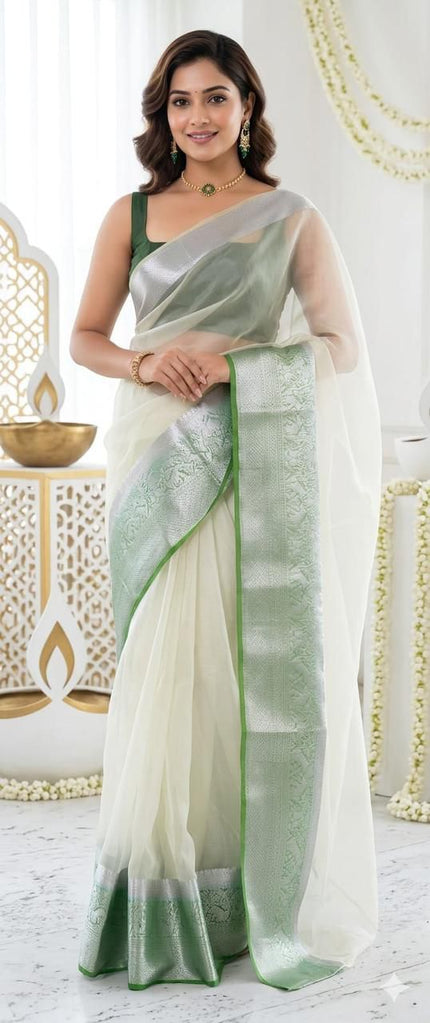Graceful Festive Wear Organza Saree with Rich Silver Zari Weaving and Contrast Blouse.