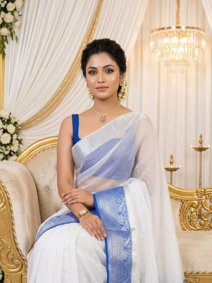 Graceful Festive Wear Organza Saree with Rich Silver Zari Weaving and Contrast Blouse.