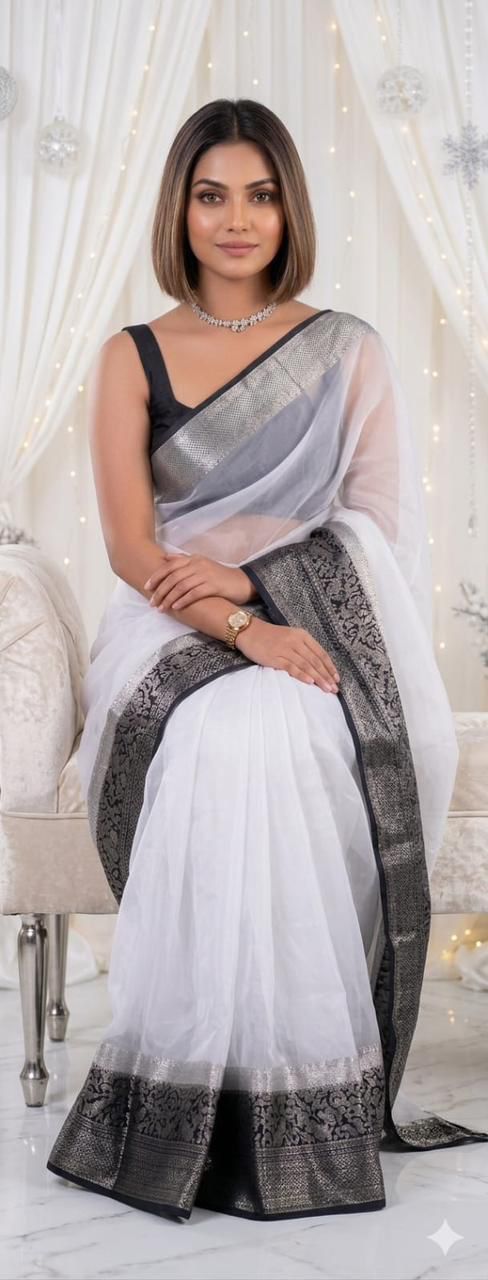 Graceful Festive Wear Organza Saree with Rich Silver Zari Weaving and Contrast Blouse.