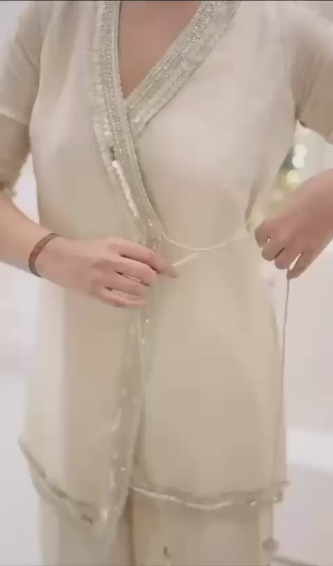 Graceful Ivory Embroidered Kurta Palazzo Set.